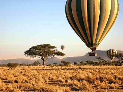 air balloons Three hot air balloons drift over the plains of The Masai Mara at dawn.