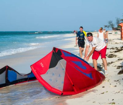 Zanzibar, Tanzania -Tourists enjoy in kiteboarding on the sandy beaches of Zanzibar.