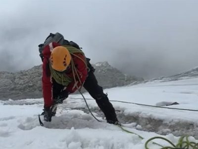 A professional hiker ascending to the top of Margherita peak (5,109m) on mountain Rwenzori in Uganda Rwenzori mountaineering excursions & hiking